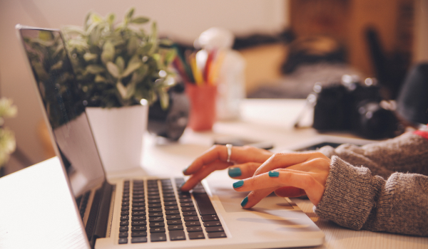 Image of a person planning a staff development course on a computer 